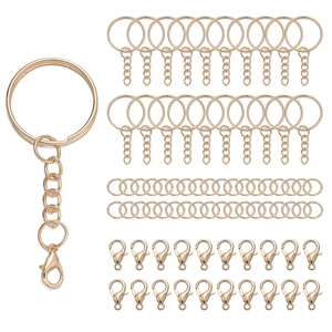 Detail of golden metal keychain set with split ring, chain, lobster clasp for DIY crafts