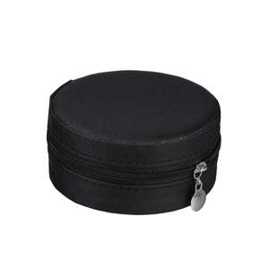 Close-up of black fabric jewelry box with anti-slip texture and silver metal zipper