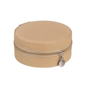 Close-up of portable round jewelry organizer in beige textured leather with zip closure
