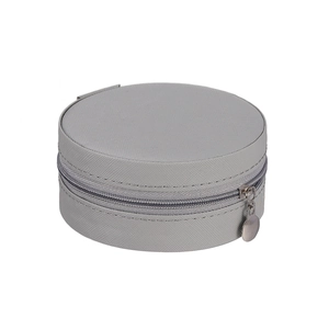 Macro shot of grey portable round jewelry case with textured fabric and silver zipper