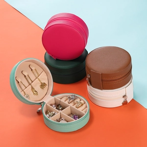 Detailed interior of a round portable jewelry organizer with hooks and ring slots