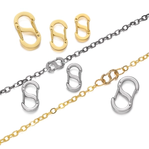 Close-up of S-shaped stainless steel jewelry clasps for DIY necklace and bracelet repair