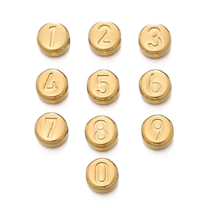 Detailed macro shot of gold polished stainless steel number beads for DIY jewelry making