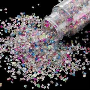Macro shot of 30g bottled colorful irregular glass stones for DIY crafts and nail art