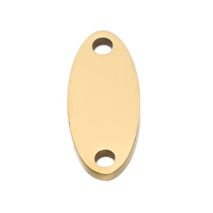 Macro detail of oval gold stainless steel jewelry connector with smooth mirror finish