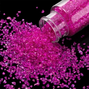 Macro detail of 30g rose pink crushed glass crystals for DIY nail art and resin crafts