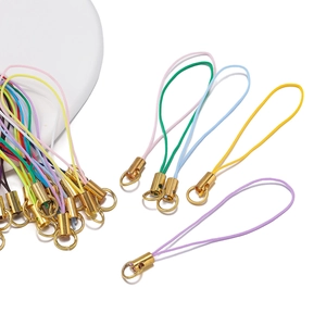 Macro shot of colorful nylon lanyards with gold metal alloy lobster clasps and closed loops