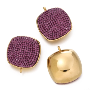 Detailed view of square gold-plated pendants with purple crystals and polished back