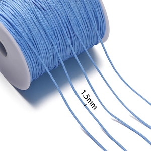 Macro view of 1.5mm sky blue nylon braided cord texture on a professional spool
