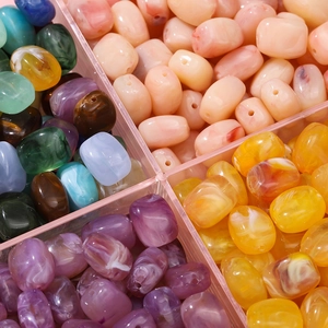 Macro shot of assorted colorful marble texture acrylic barrel beads for DIY jewelry making