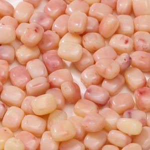 Close-up of pink acrylic rectangle beads with red marble pattern and large holes for DIY