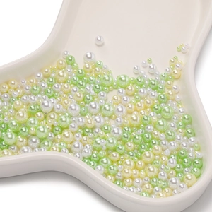 Colorful ABS faux pearls in white, green and yellow for DIY craft projects