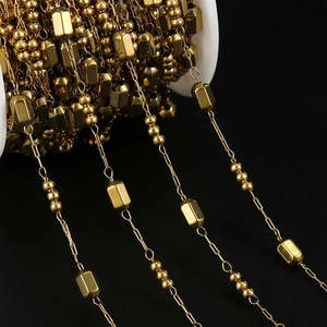 Detail of gold vacuum plated stainless steel square link chain with round beads for DIY jewelry