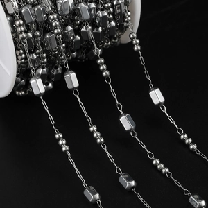Detailed macro view of square and round bead stainless steel DIY jewelry chain