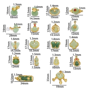 Detailed view of Chinese jade pendants with gold edges and measurement specifications