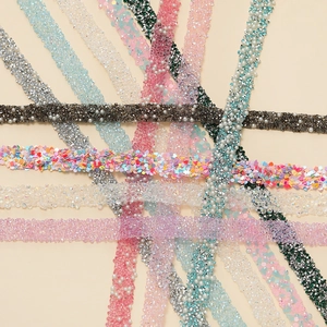 Detailed assortment of self-adhesive rhinestone trims and pearl strips for DIY crafts