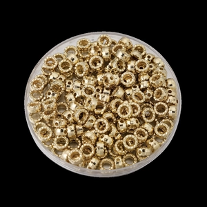 Perles d'étoiles dorées pour création bijoux DIY dans une boîte transparente