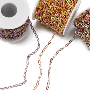 Detail of colorful enamel oval chains on gold spools for DIY jewelry making