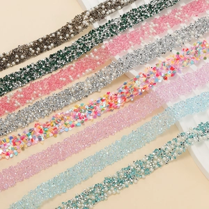 Macro detail of various self-adhesive rhinestone and pearl trim strips for DIY accessories