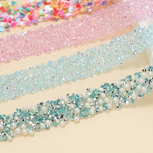 Detail showing heart sequins, pink crystals, and pearl rhinestone strips for DIY decor