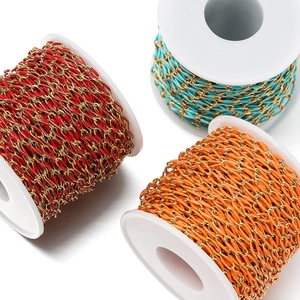 Macro detail of colorful enamel twisted oval chains on reels for DIY jewelry making