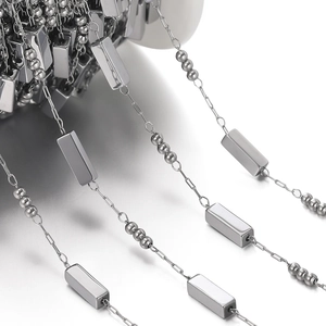 Detail of square link and bead chain made of polished stainless steel for DIY jewelry