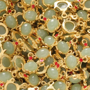 Pile of Chinese style gold alloy teapot pendants with green jade-like stones for DIY