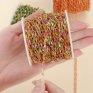 Macro detail of colorful enamel gold chain roll for DIY jewelry bracelet making