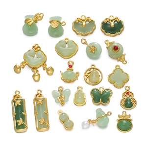 Traditional green jade-style charms with gold alloy edges in various vintage patterns