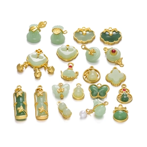 Collection of Chinese style green jade pendants with gold alloy floral and lock charms