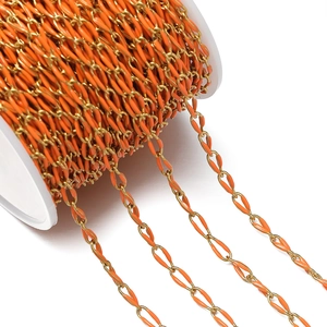 Close-up of golden stainless steel chain with vibrant orange enamel drip finish for DIY