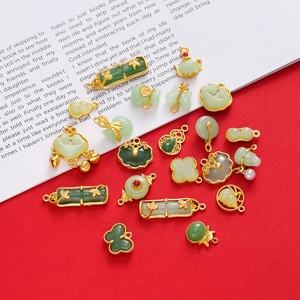 Traditional Chinese style jade-like pendants with gold-plated frames and symbolic charms