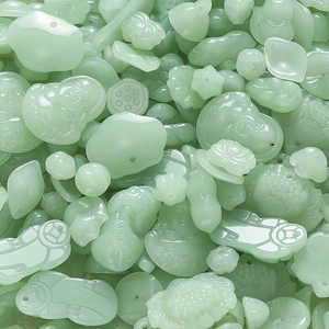 Close-up of assorted light green jade-style pendants in traditional Chinese folk motifs
