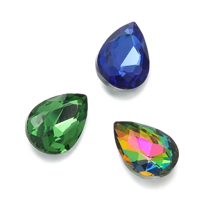 Detail of tear-drop glass crystals in blue, green, and AB colors for sewing projects