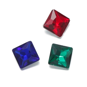 Macro view of square glass crystals in red blue and green princess cut for DIY crafts