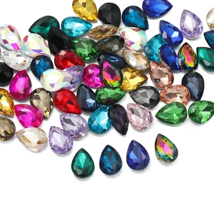 Detailed view of colorful teardrop glass rhinestones with faceted surface and metal base