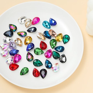 Macro shot of colorful pear-shaped crystal glass rhinestones for DIY sewing and jewelry
