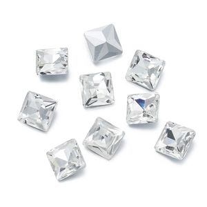 Macro shot of square faceted crystal glass rhinestones with silver metal backing detail