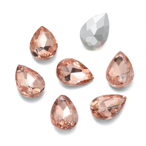 Detailed view of teardrop champagne and silver faceted crystals for DIY dress sewing