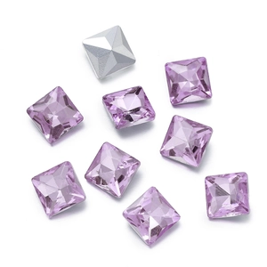 Macro shot of square faceted lavender crystals with silver foil backing for DIY crafts
