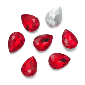 Macro shot of red teardrop-shaped crystal glass rhinestones for DIY sewing decorations