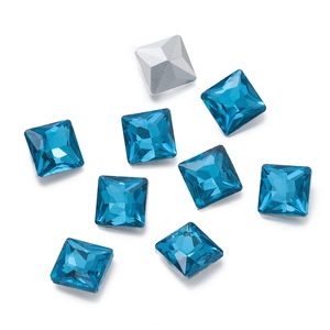 Detailed view of square blue crystal glass rhinestones with silver pointed-back bases