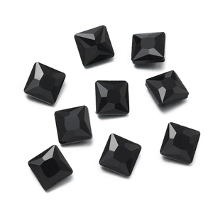 Macro detail of nine black faceted square glass rhinestones for DIY craft decorations