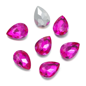 Macro view of teardrop pink faceted crystal glass rhinestones for DIY bridal jewelry