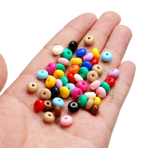 8mm colorful acrylic candy wheel beads for DIY jewelry making held in palm on white background