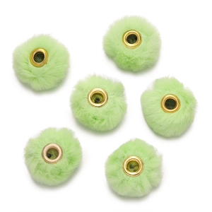 Close-up of 6 mint green faux rabbit fur beads with gold metal centers for DIY crafting
