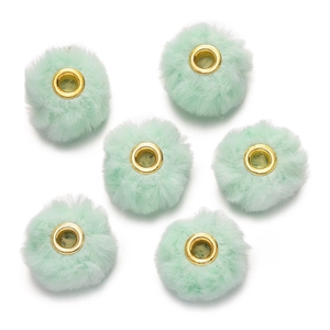 Close-up of mint green faux rabbit fur beads with gold metal large hole spacers for DIY jewelry