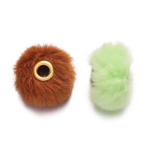 Detail of soft faux rabbit fur beads in brown and green with golden metal grommets for DIY