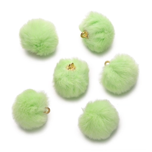 Detailed view of light green faux mink pom-poms with golden loops for DIY jewelry