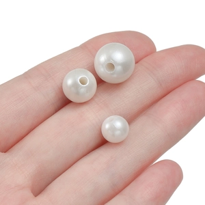 Three sizes of white ABS faux pearl beads with through-holes for DIY jewelry making